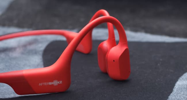 A pair of red bone conduction headphones