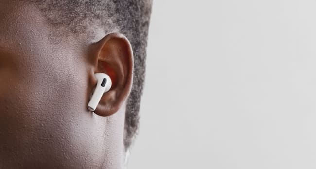 White true wireless earbud inside the ear 